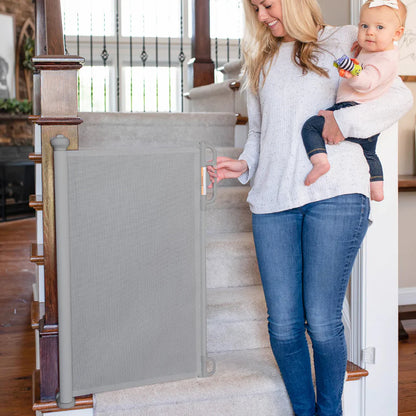 Puerta retráctil de seguridad para bebés Momcozy